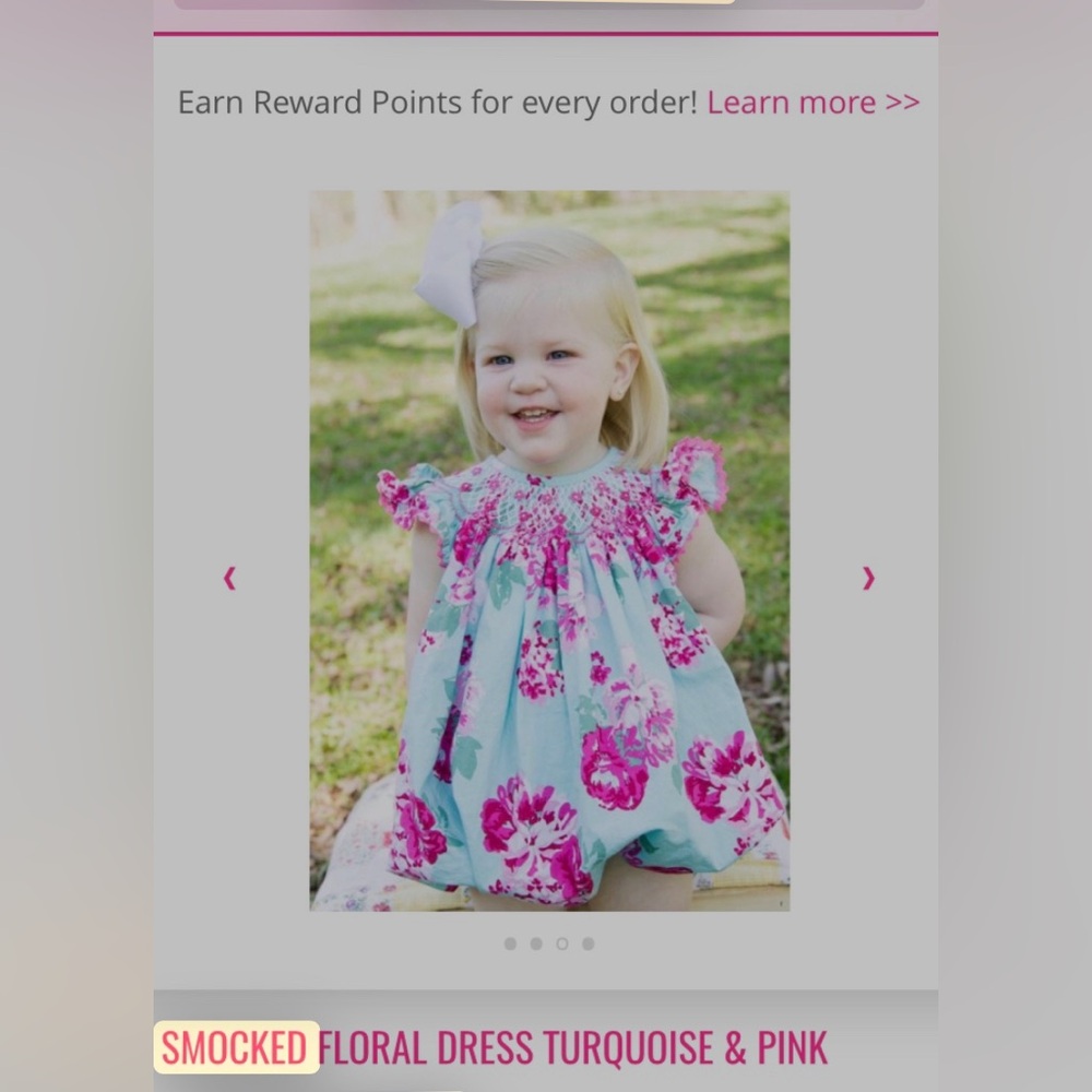 Smocked Auctions.  New with tags.  Turquoise with pink flowers.  Runs large